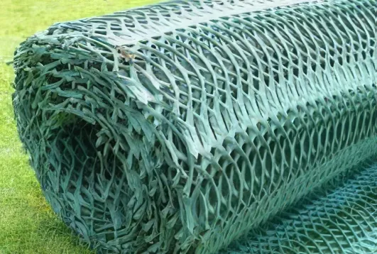 roll of Indonet grass reinforcement mesh placed on a green lawn