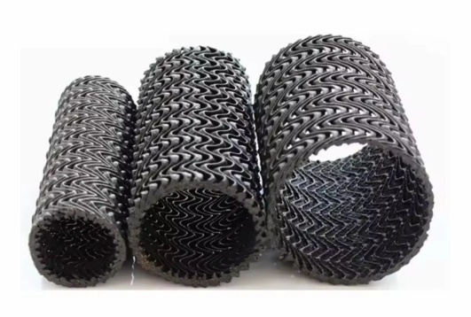 Cylindrical permeable drainage pipes used in geosynthetic drainage systems for soil stabilization and water flow