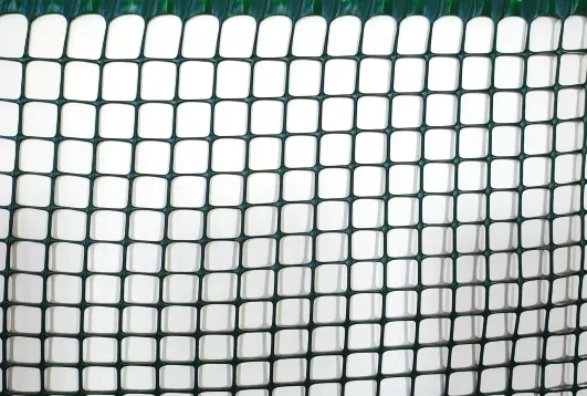 close-up view of plastic square fencing net showing uniform grid structure