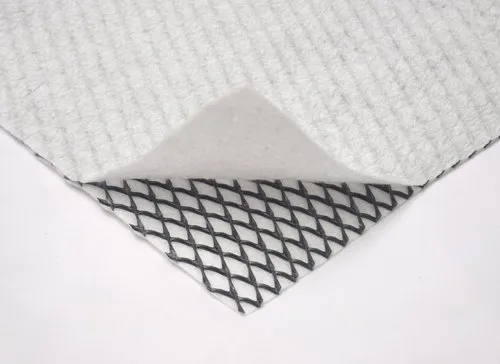Geotextile and geogrid composite layer for road construction applications.