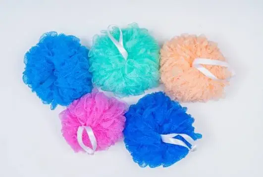 colorful mesh bath loofahs with white hanging loops