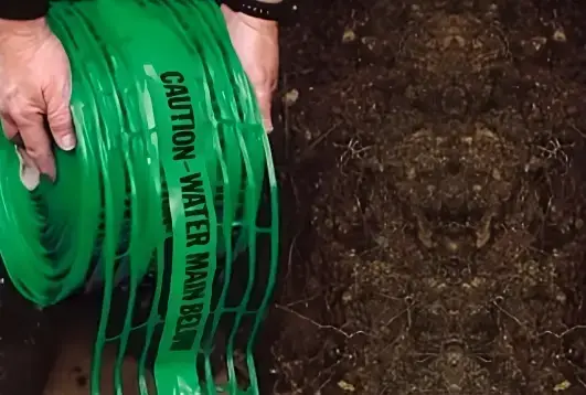 Green warning mesh for marking water mains and restricted areas, providing site safety, supplied by Indonet Group