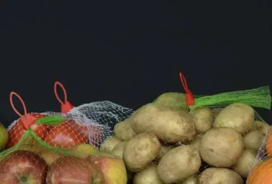 potatoes and apples packaged in breathable mesh net bags